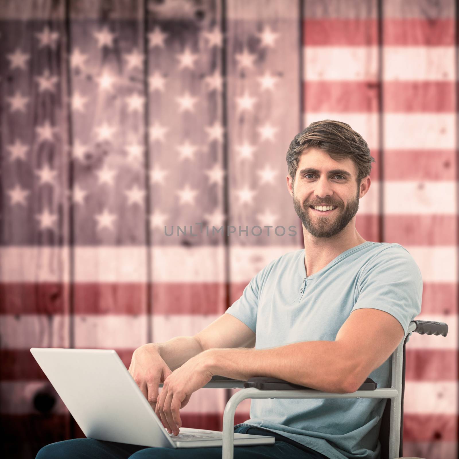 Young businessman using laptop against composite image of usa national flag