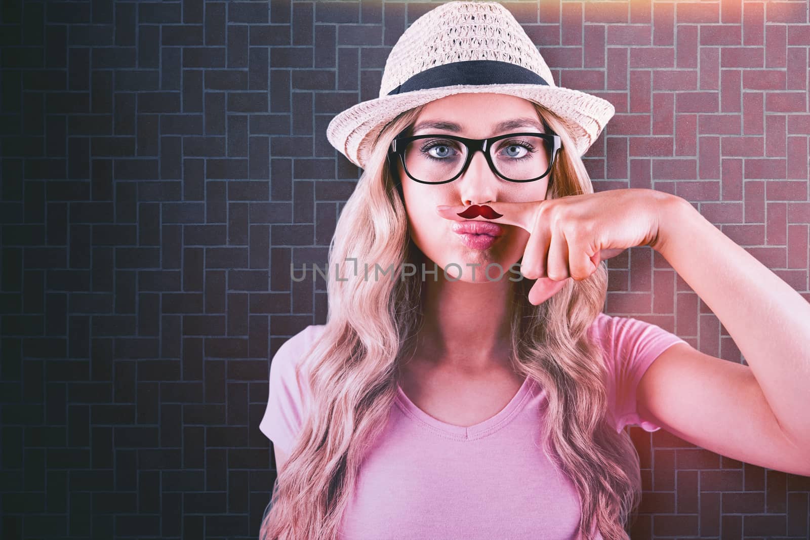 A beautiful hipster having a fake distinguished mustache  against textured background