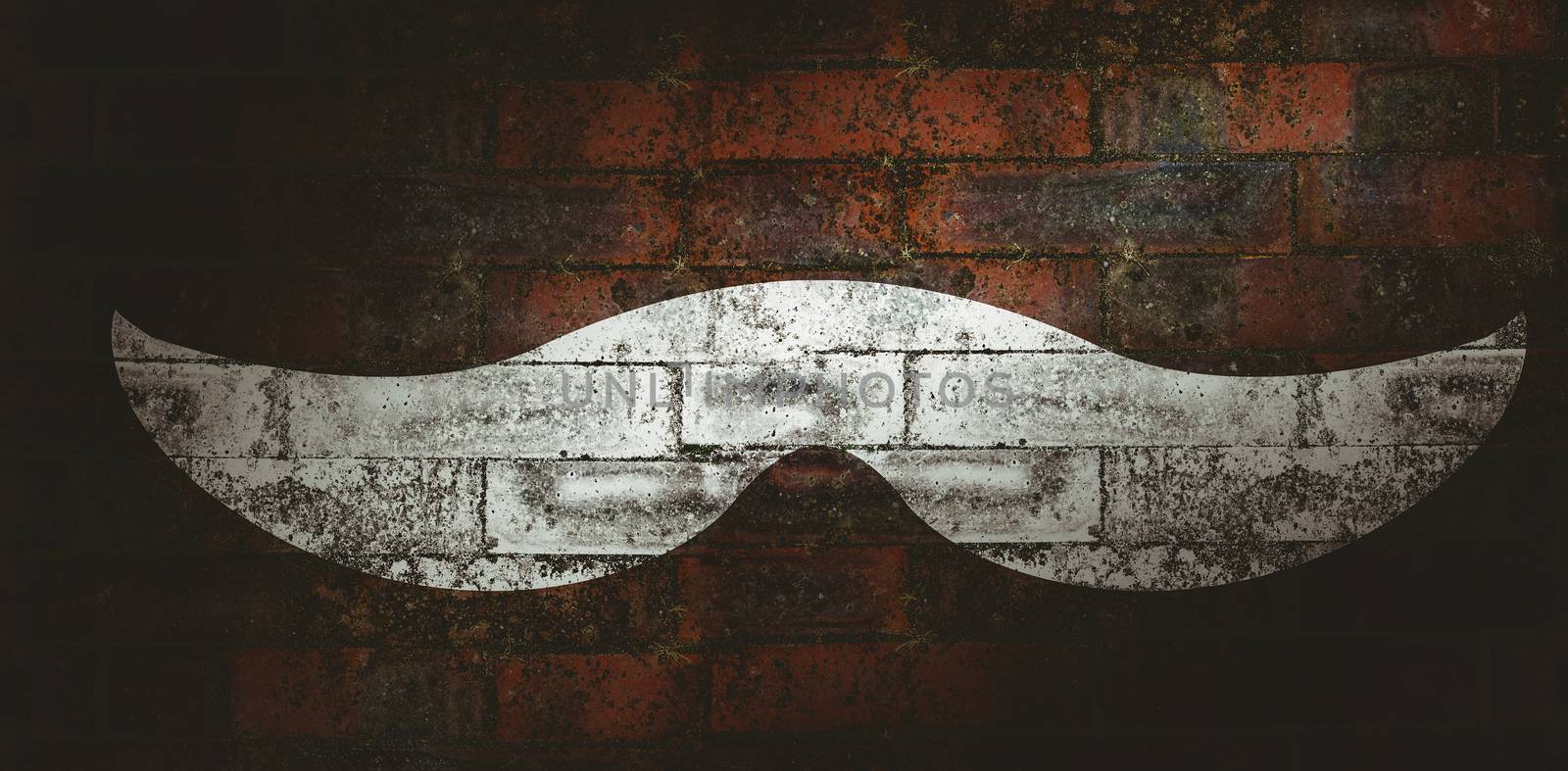 Icon of a mustache against texture of bricks wall