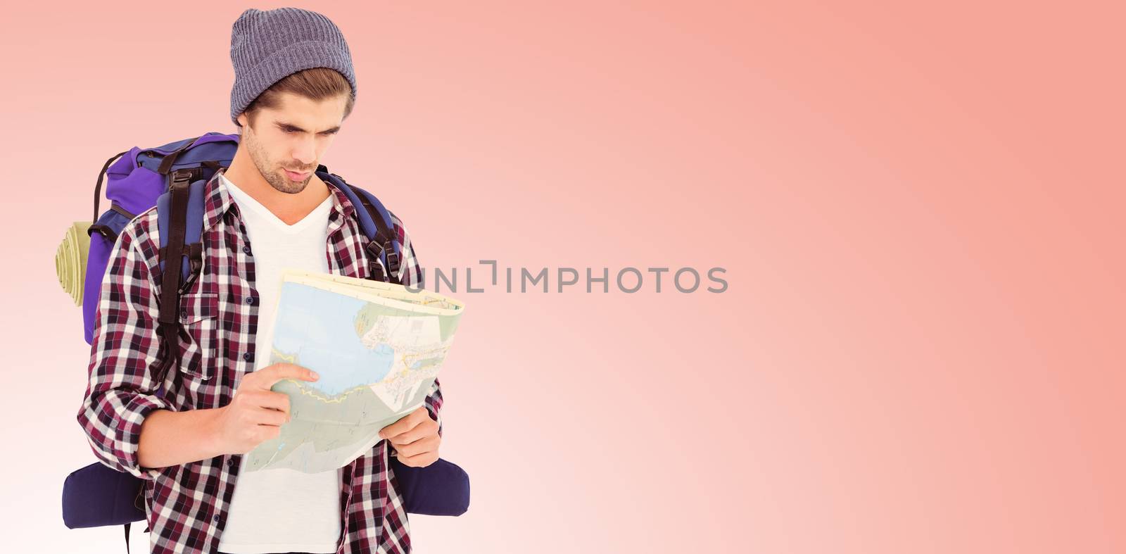 Composite image of man with luggage looking in map by Wavebreakmedia