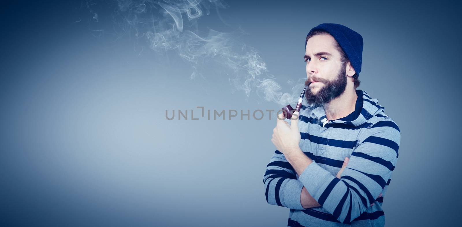 Composite image of portrait of serious hipster smoking pipe by Wavebreakmedia