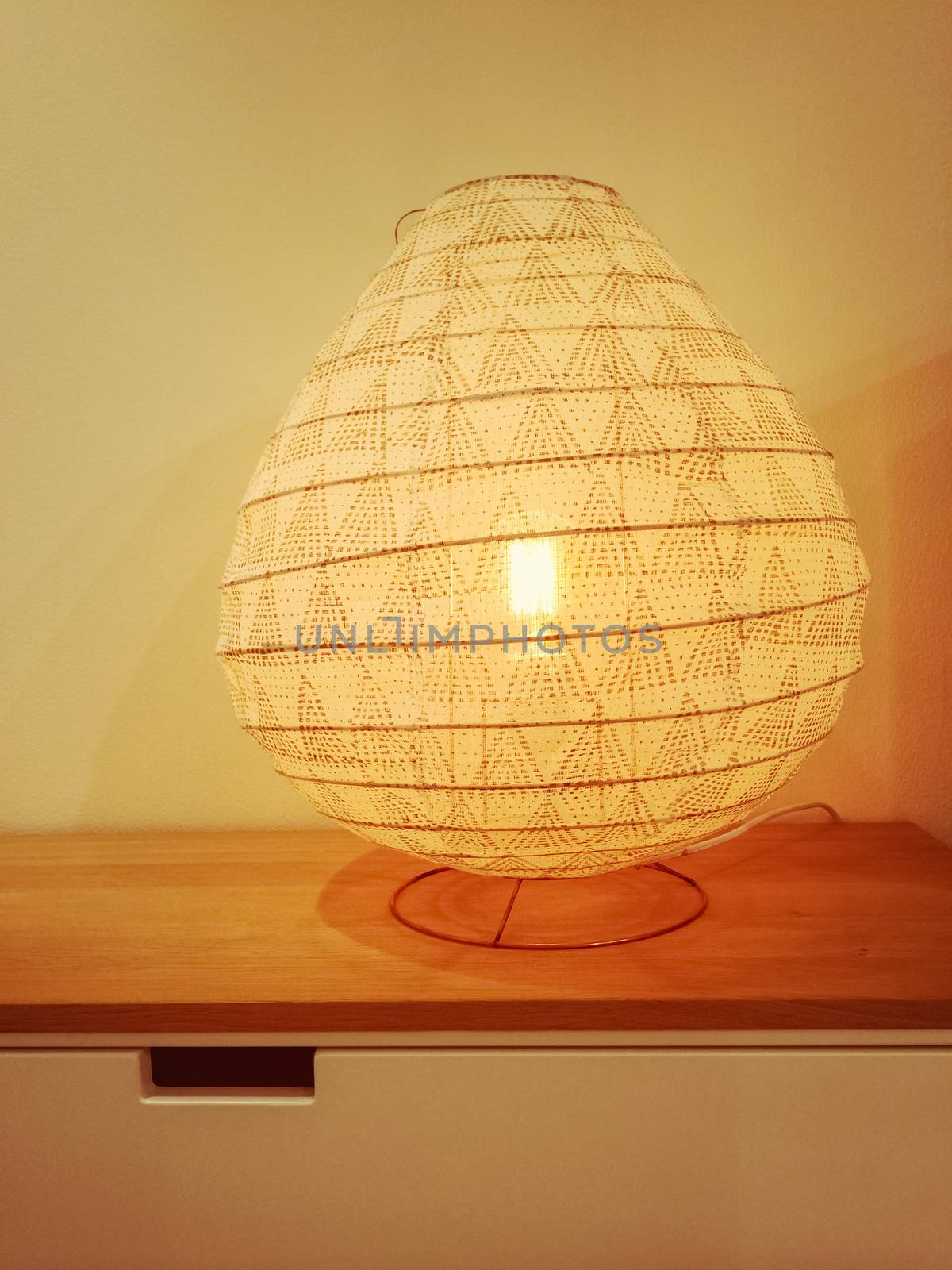 Cozy lamp giving warm yellow light. Interior design.