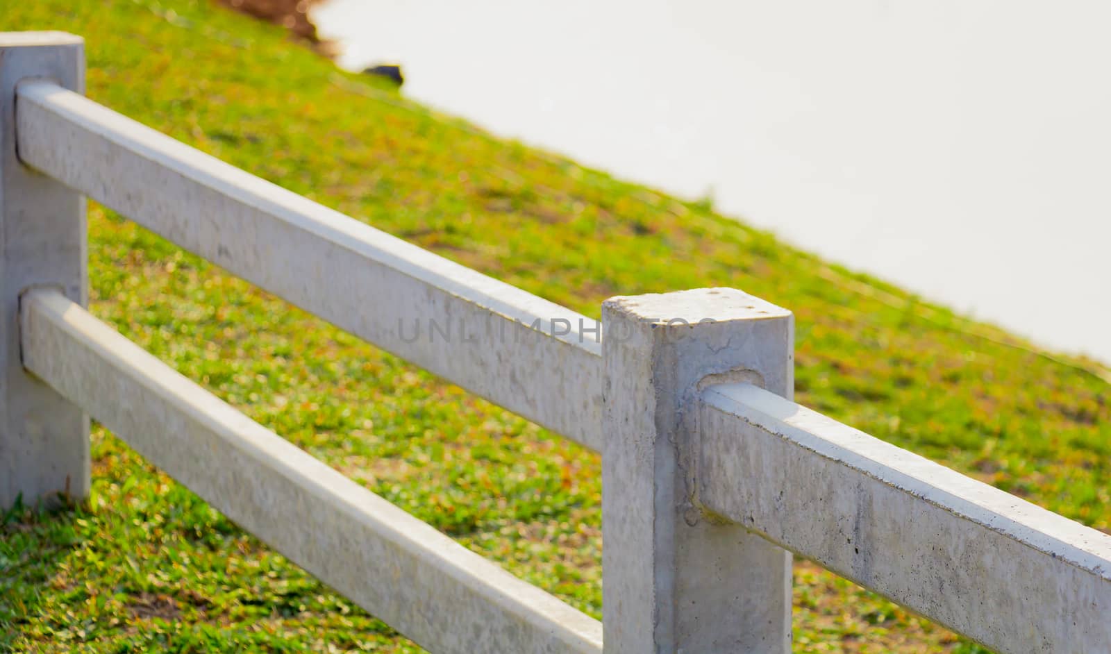 white concrete fence in country farm land