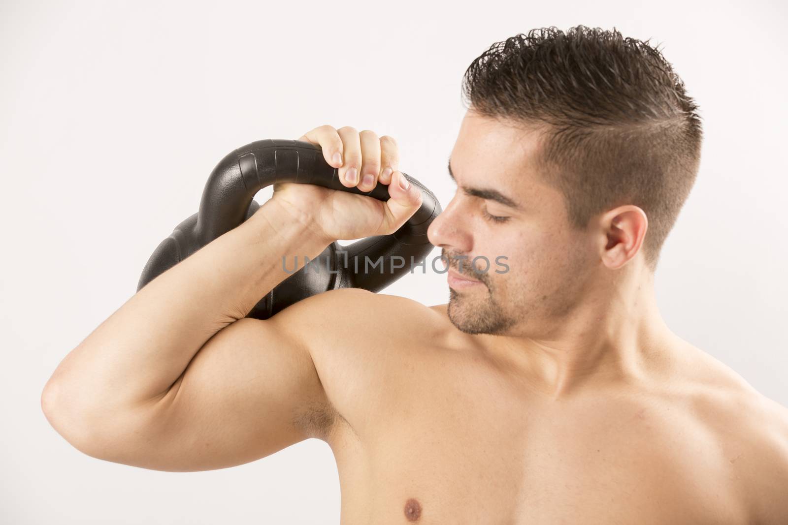 Sexy Young fashion sport man, fitness muscle model guy making push ups exercise over white background.