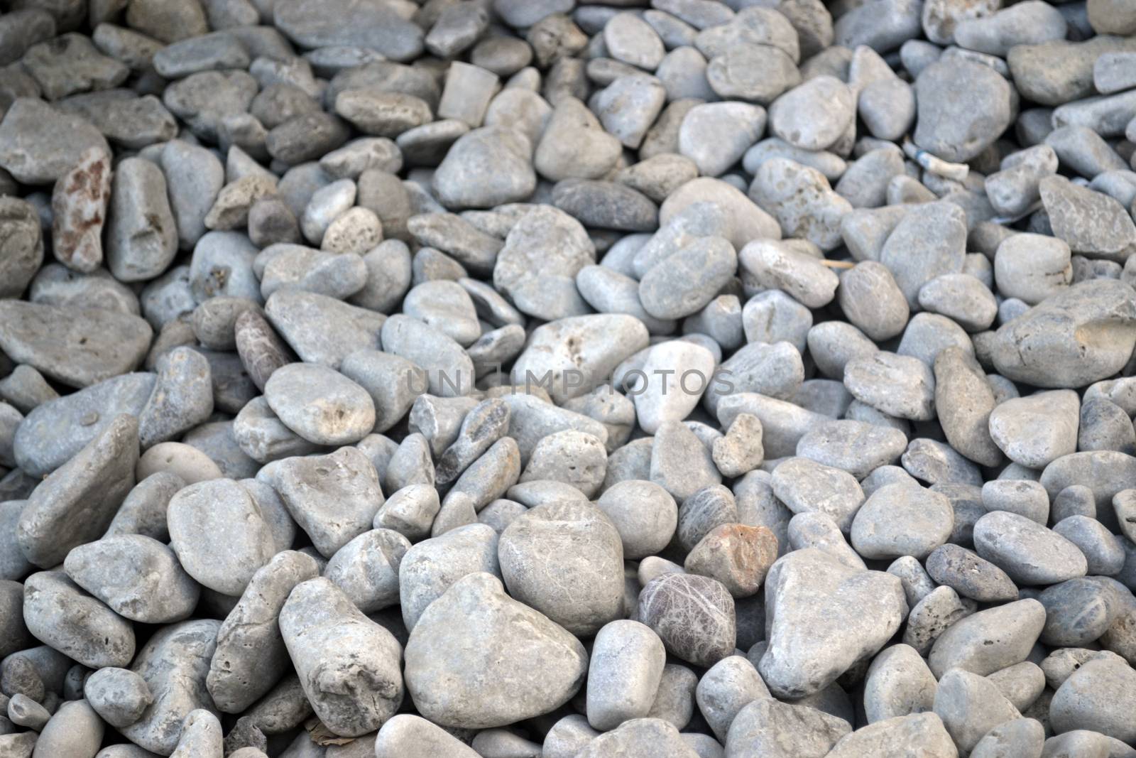 Backround of nice grey pebble stones with interesting shape