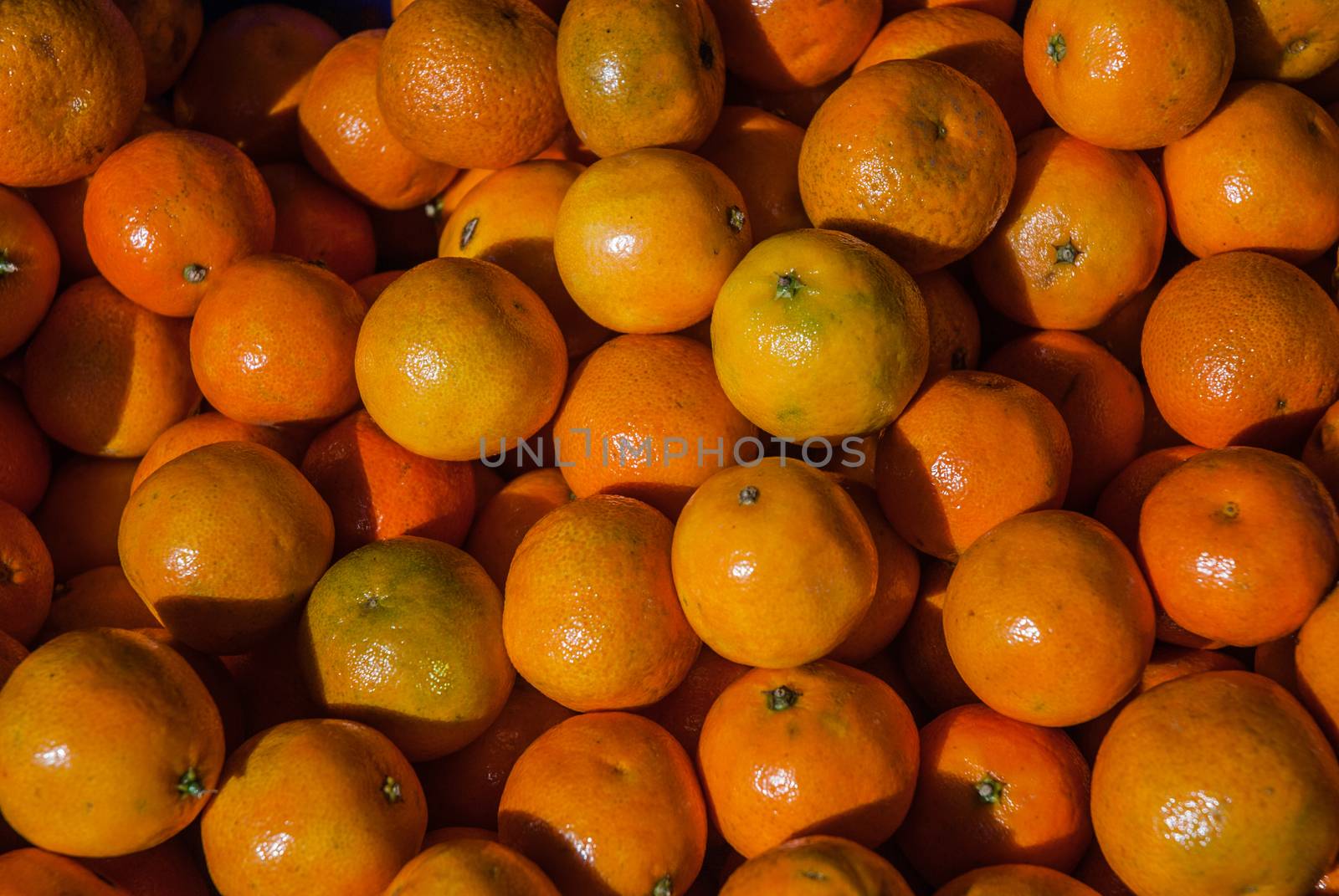 Mandarin oranges on market by AnaMarques