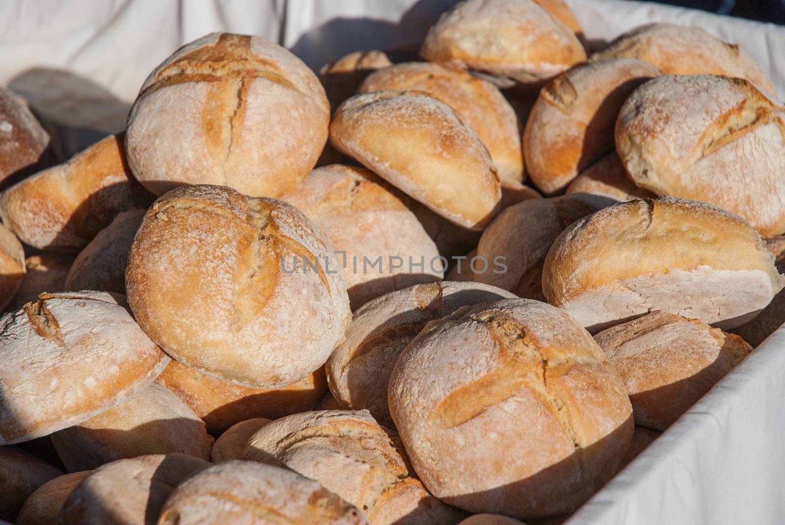 Large basket of bread. Bread in basket - little roll breads in basket