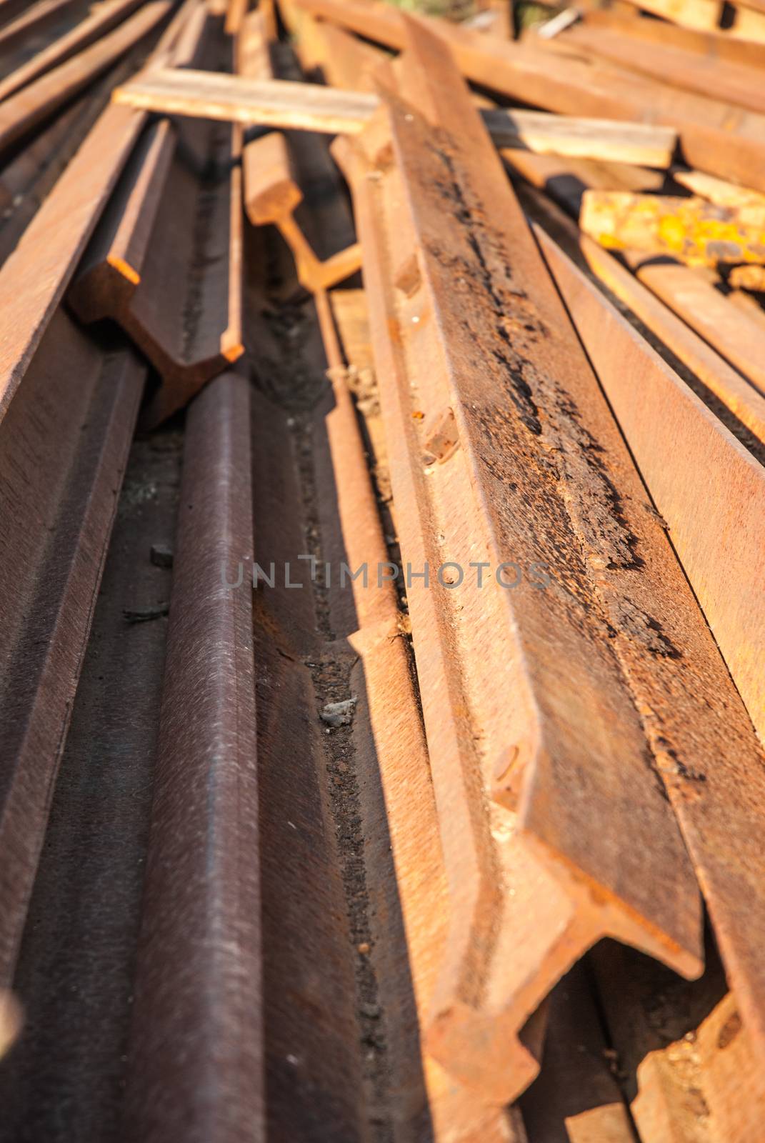 Stack of railway tracks. Old rusted rails