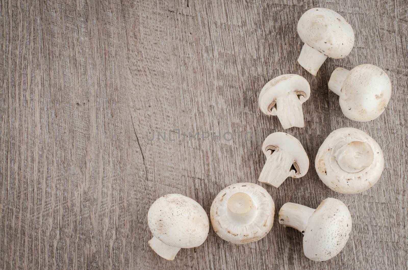 Fresh mushrooms on a wooden background.