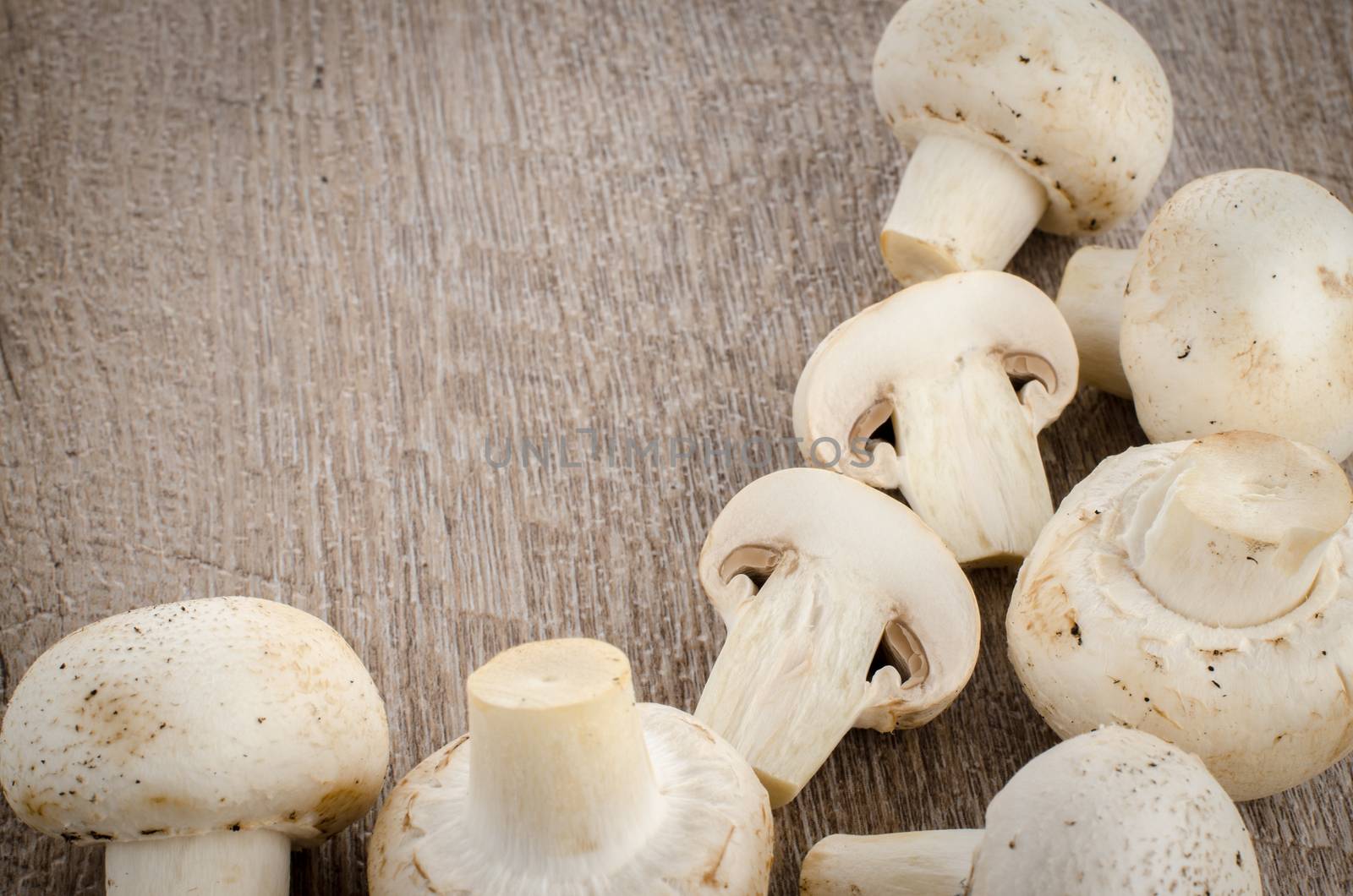 Fresh mushrooms on a wooden background.