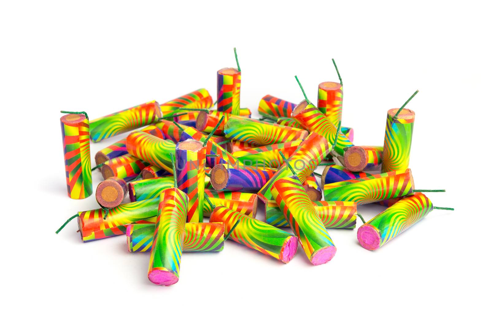 Heap of colorful firework isolated on white background by BenSchonewille