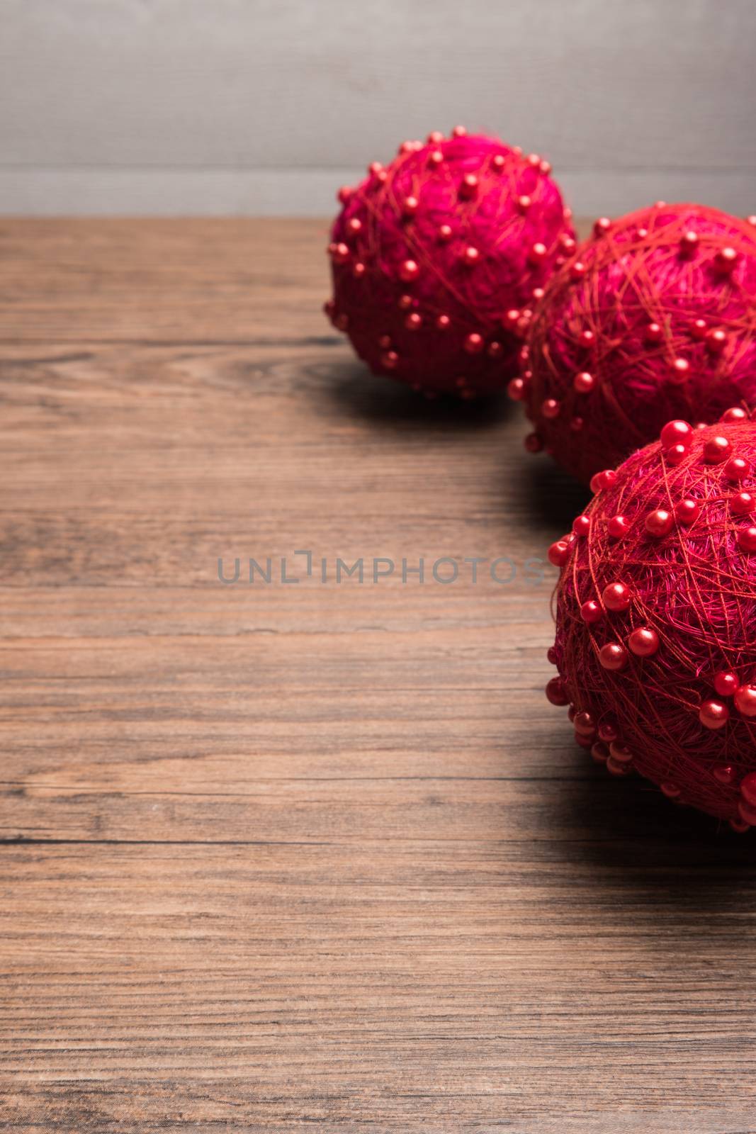 Christmas border design with christmas balls over old oak wood