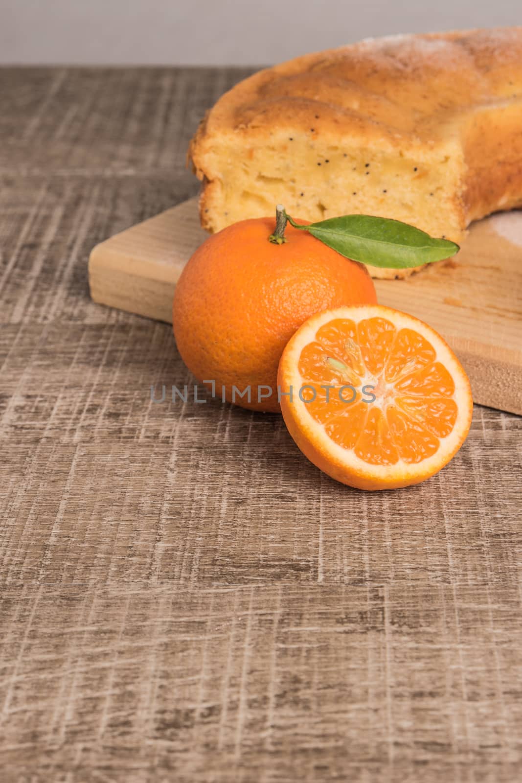 Slices of clementine cake with powdered sugar topping. Cake on a by AnaMarques