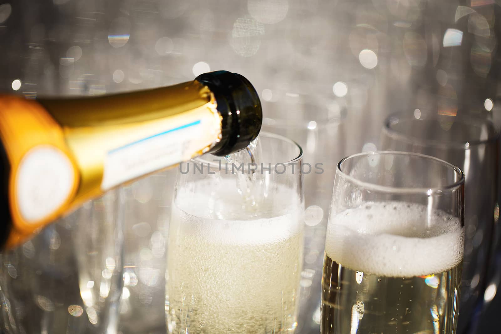 Pouring a glass of champagne on some event 
