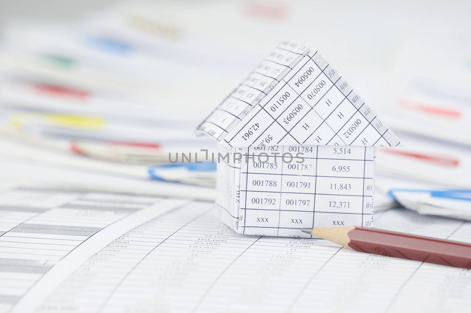 Close up house with pencil have step paperwork as background by eaglesky