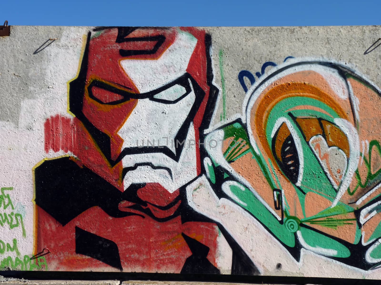 Graffiti Iron Man on a concrete wall in the city of Volgograd