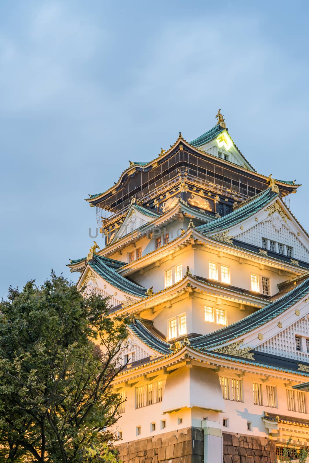 Osaka castle in cloudy sky before the rain fall down in Osaka, Japan.