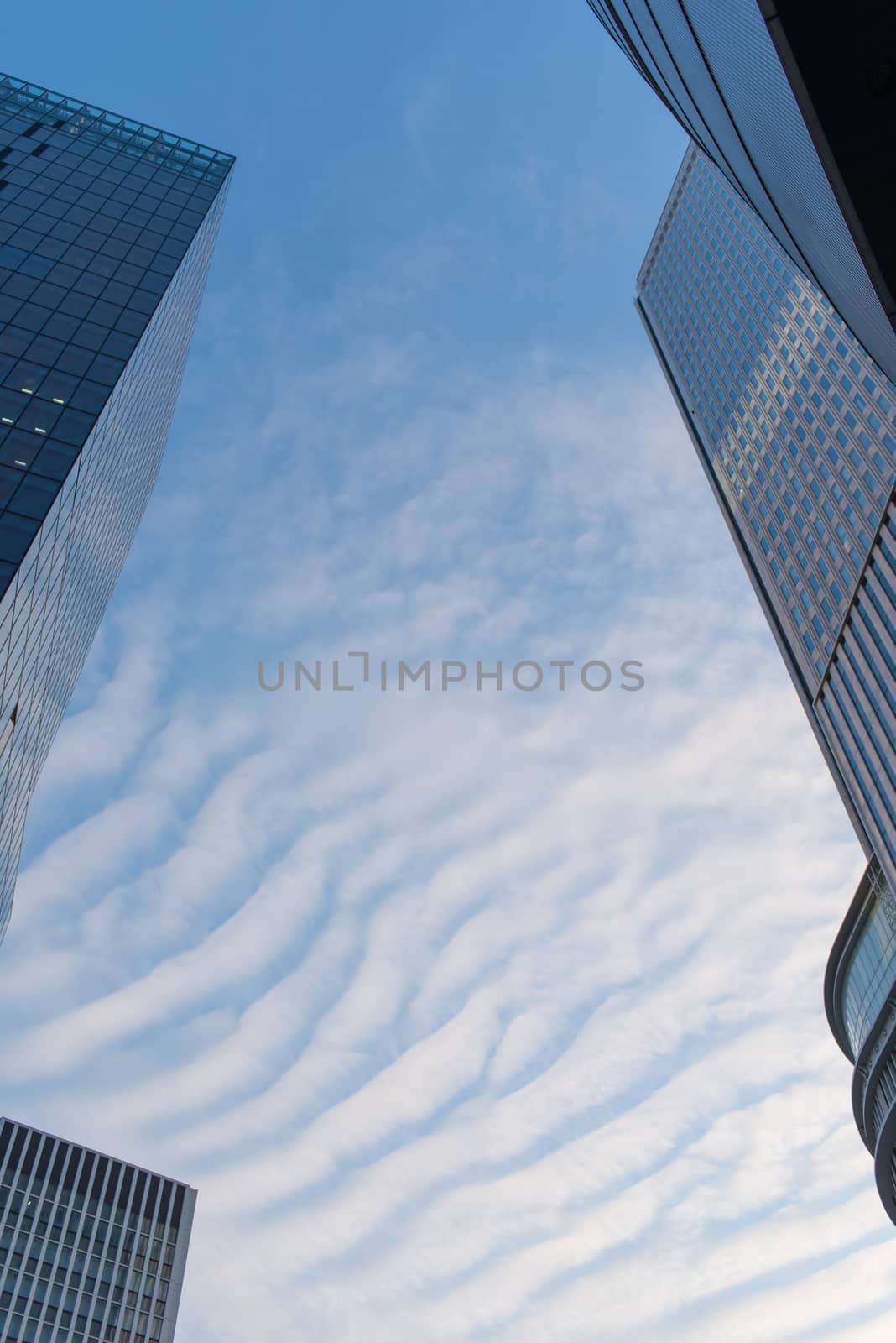 Osaka, Japan - November 4 : Upside view of office building in blue sky wave pattern