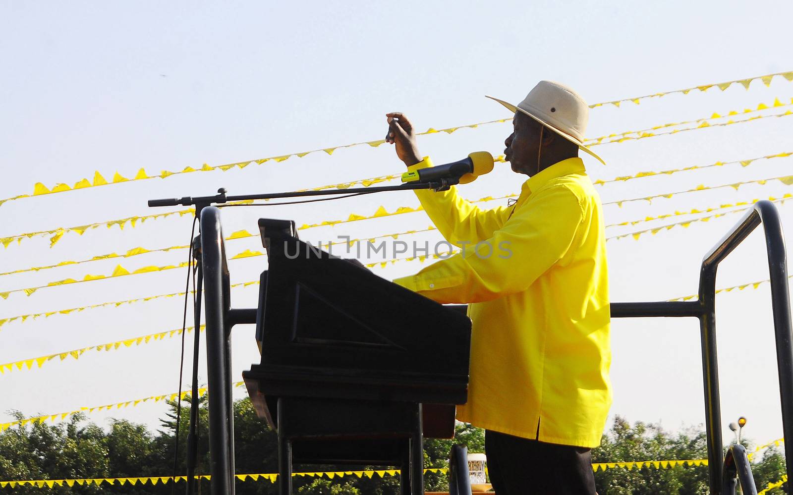 UGANDA, Kampala : Uganda's president Yoweri Museveni addresses supporters during a rally of the ruling National Resistance Movement (NRM) party at Kololo Airstrip in Kampala on February 16, 2016.Uganda's presidential contenders held their final campaign rallies on February 16, a day after opposition supporters clashed with police leaving at least one person dead. Museveni and his ruling National Resistance Movement (NRM) party is widely predicted to win a fifth term in power in polls, and warned at a rally against voting for his rivals. 