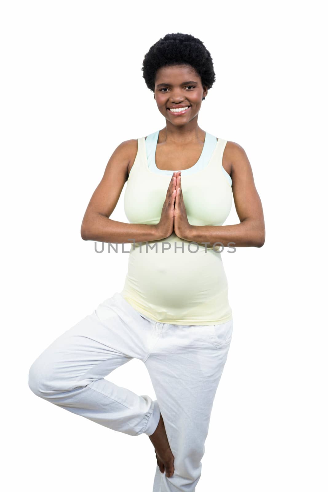 Pregnant woman doing yoga exercise by Wavebreakmedia