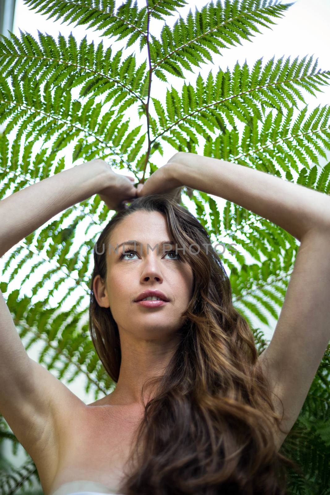 Beautiful woman standing outdoors in garden by Wavebreakmedia