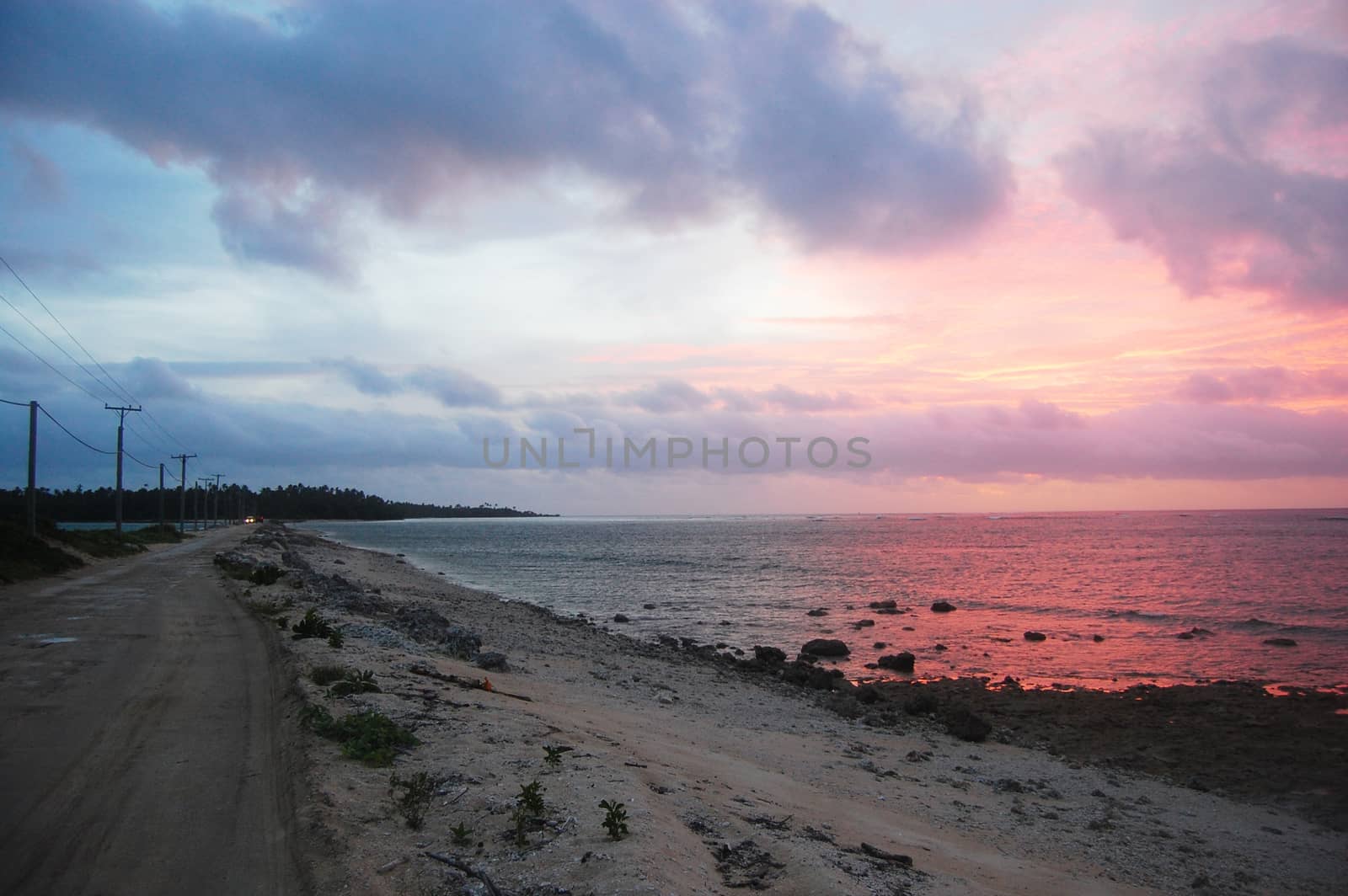 Gravel road between islands evening twilight, Haapai Islands, Polynesia, South Pacific, Tonga