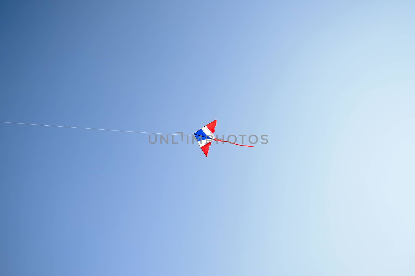 Kite flying in the wind and clear sky with copy space