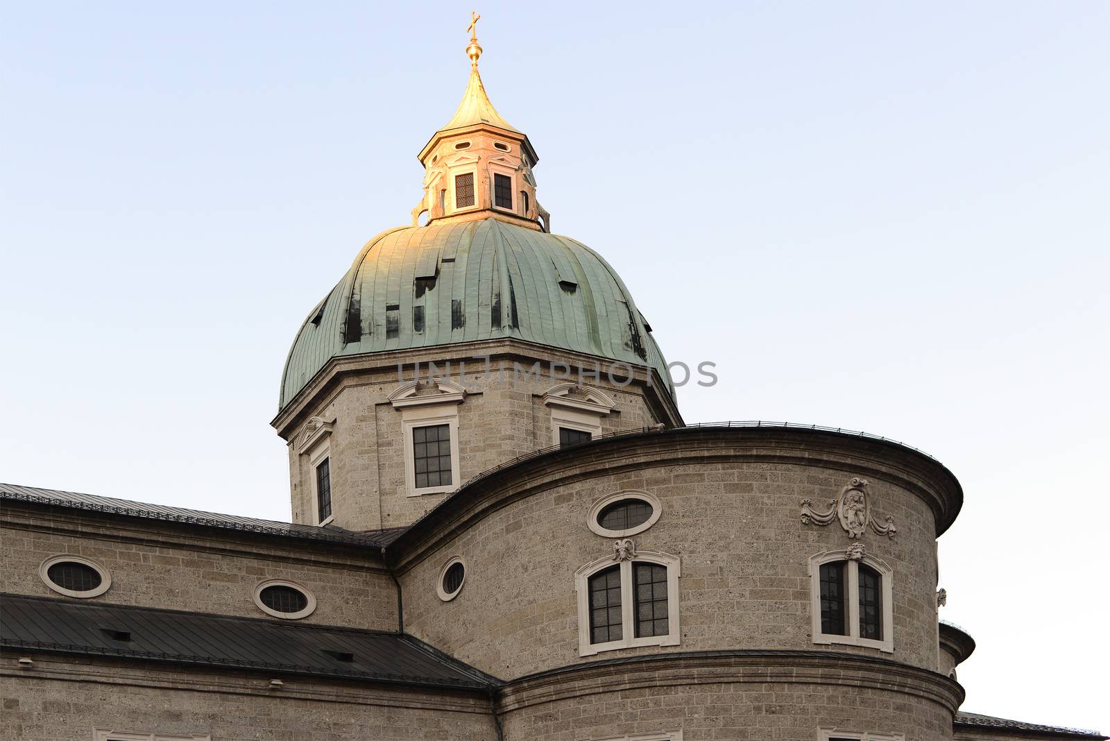Ancient european church with top of dome against sunlight, Salzburg by gypsygraphy