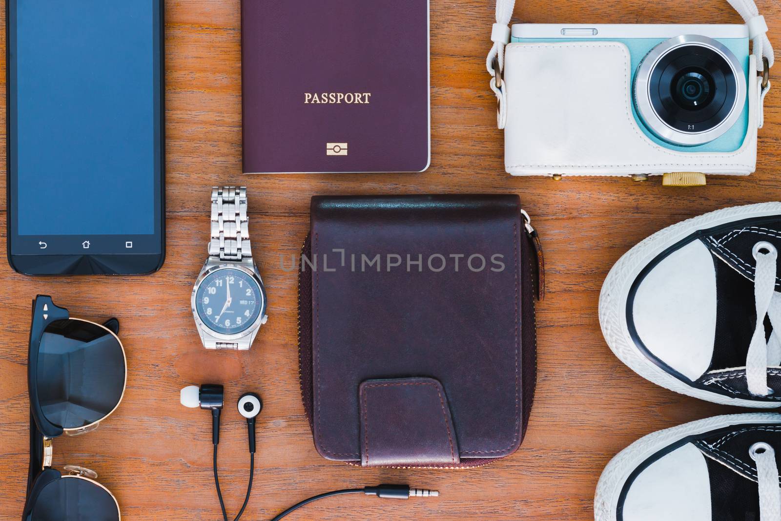 travel background with Items photo camera, passport, wallet , Watches, headphones, shoes, sunglasses, smartphone