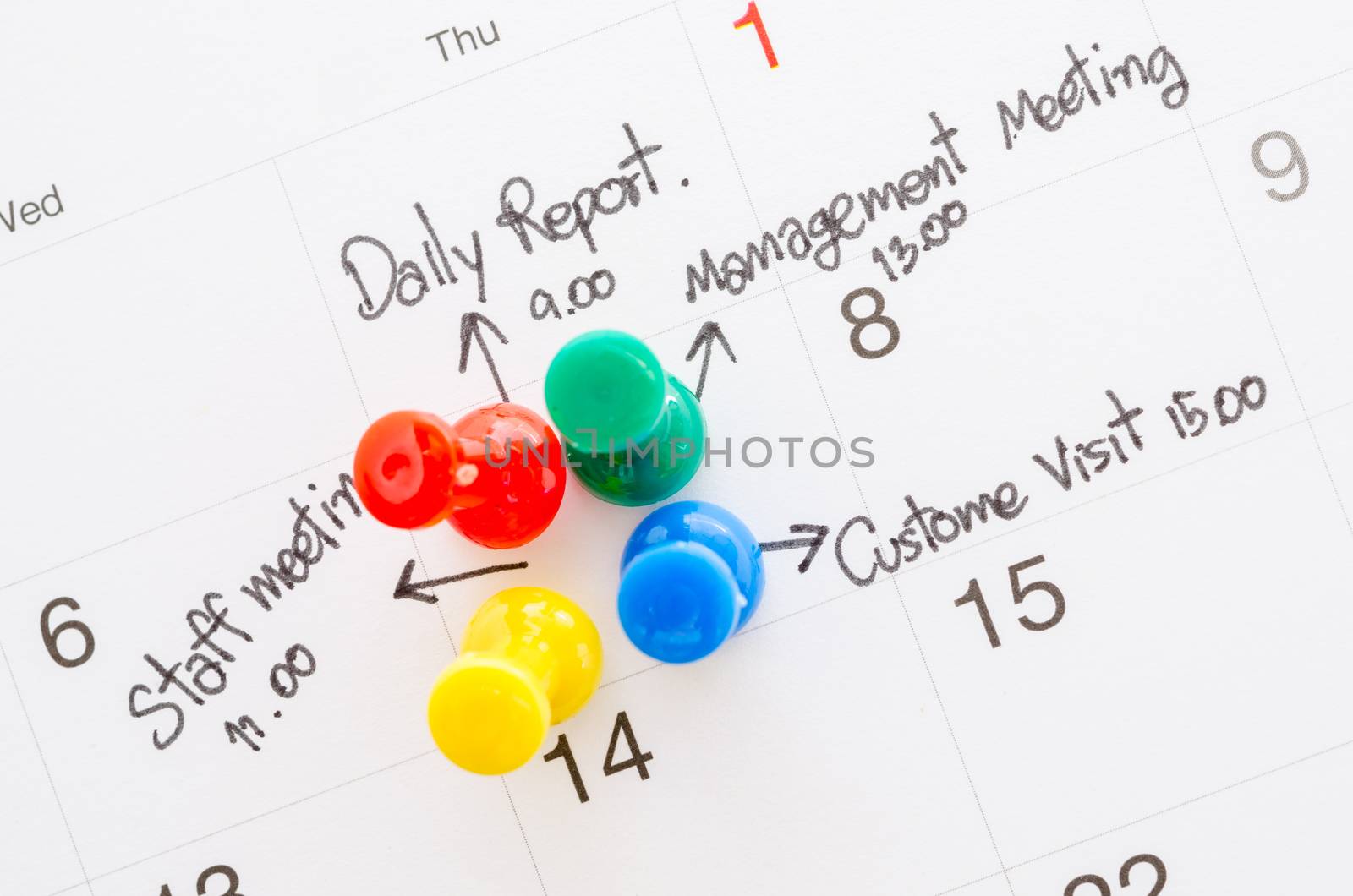Pushpin on calendar with busy day overworked schedule.