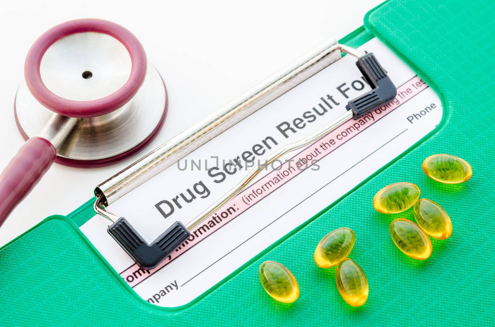 Drugs and drug screen result form in file with stethoscope on white background.
