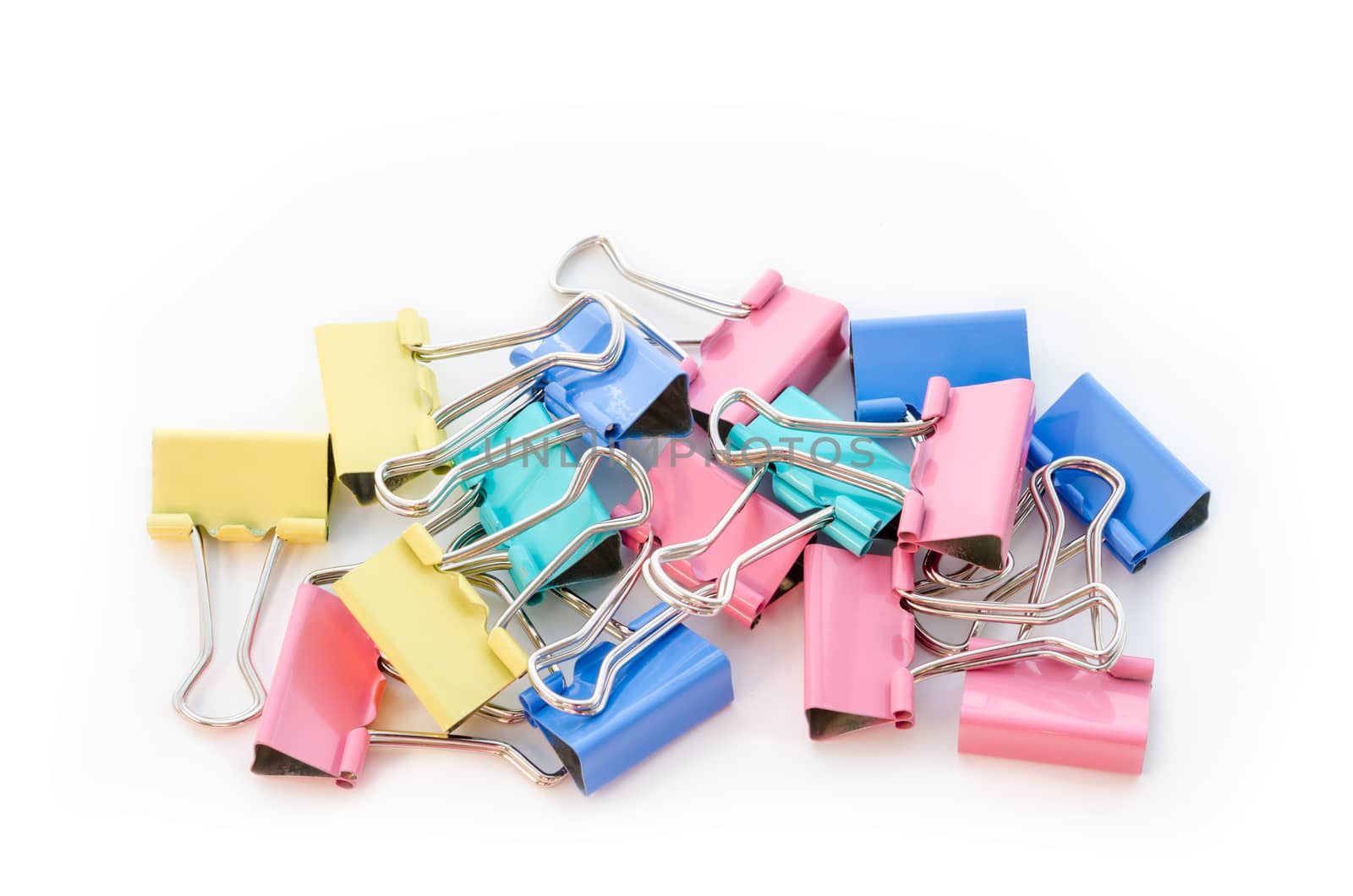 Binder clips on white background.