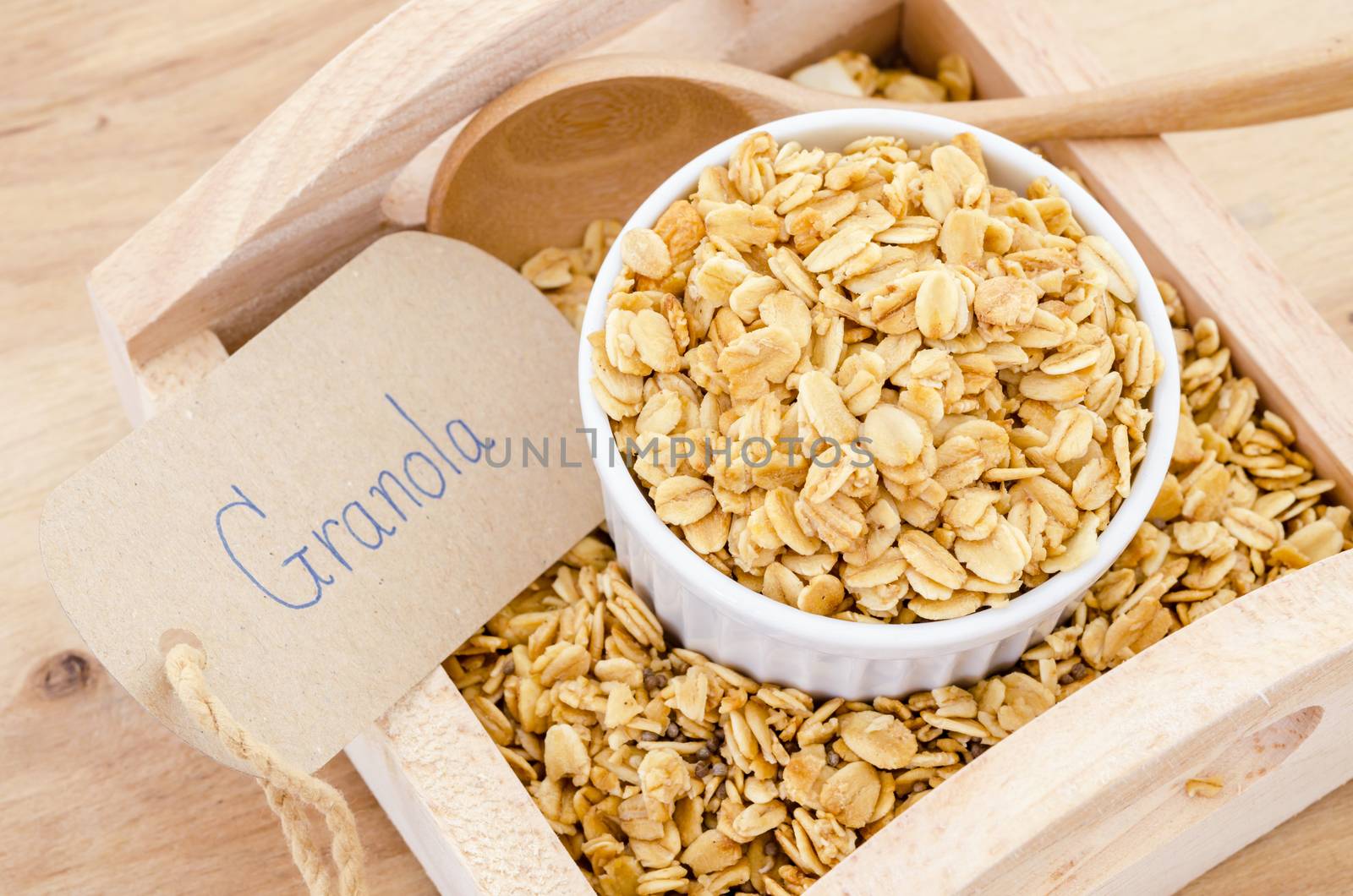 homemade healthy granola with granola paper tag on wooden background.