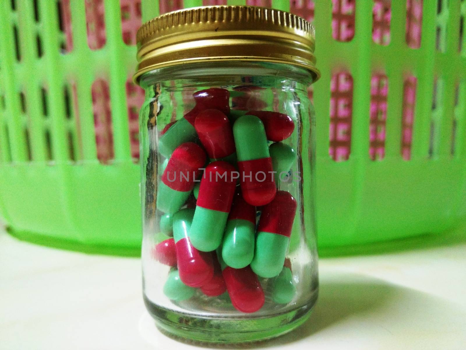 Red and Green Capsule in the Bottle
