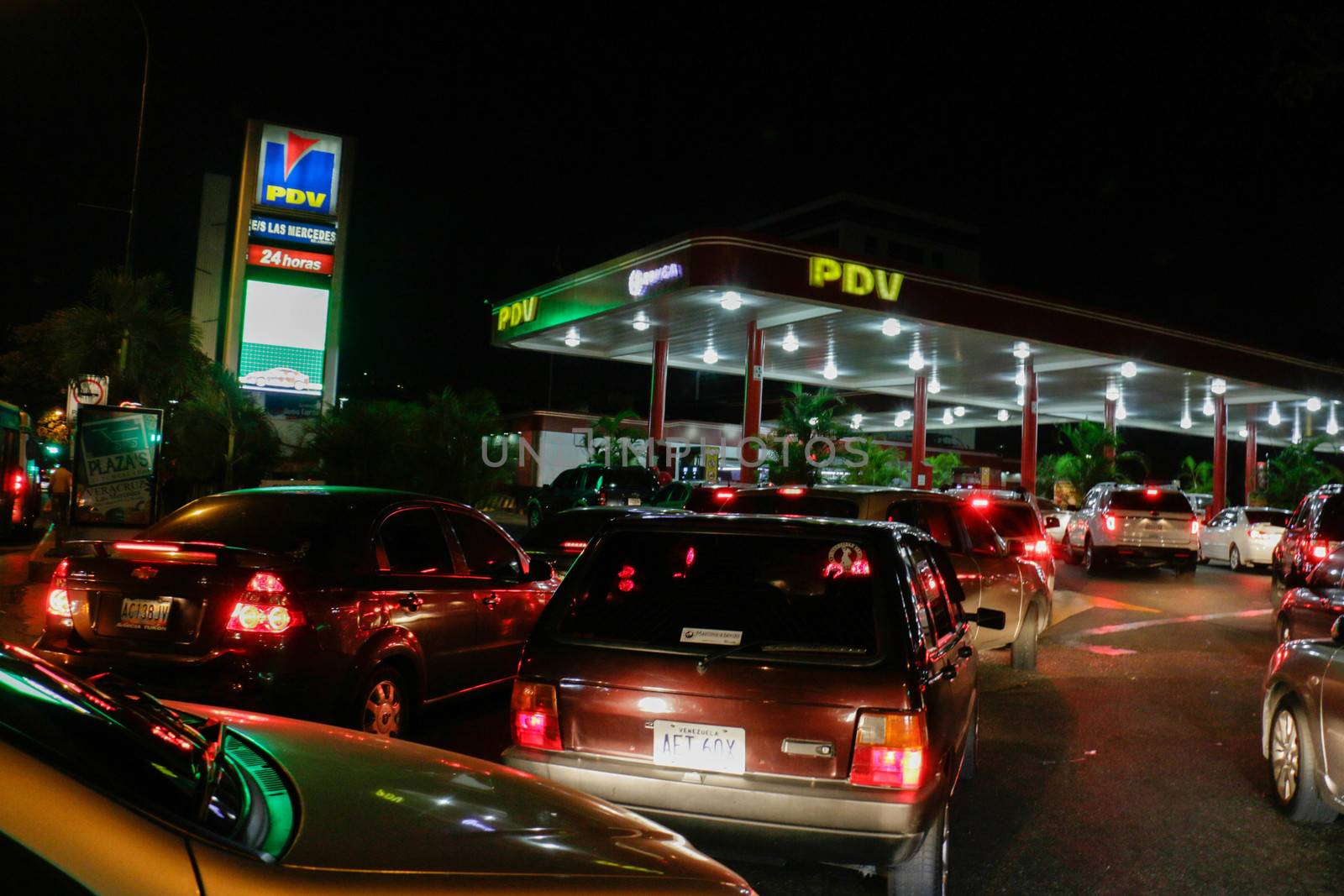 VENEZUELA, Caracas: Cars queue at a gas station in Caracas, on February 17, 2016. Venezuela's President Nicolas Maduro said Wednesday he would raise the price of gasoline for the first time in 20 years, as he faces growing pressure to ease an economic crisis. Maduro said in a televised address he would raise the pump price of premium gasoline from its current super-low level of $0.01 to the equivalent of $0.95 at the fixed official exchange rate, in a country where citizens are struggling with soaring inflation.