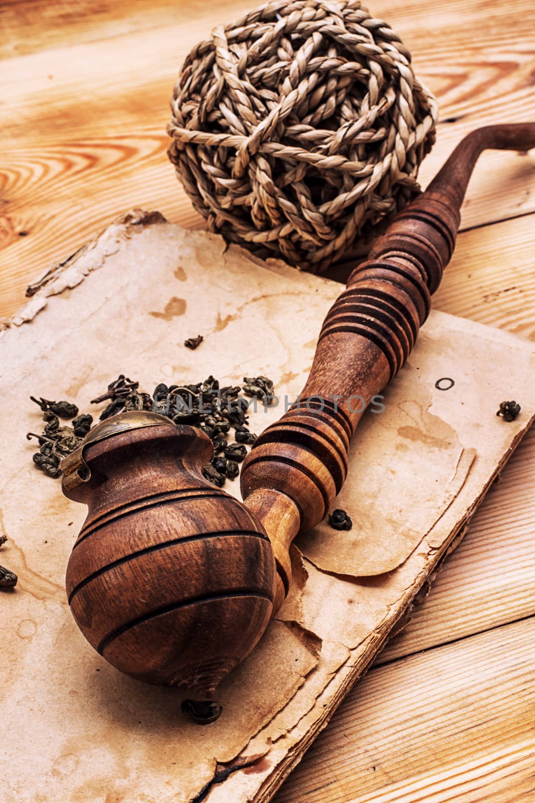Smoking pipe in a retro style,dark chocolate  on wooden background