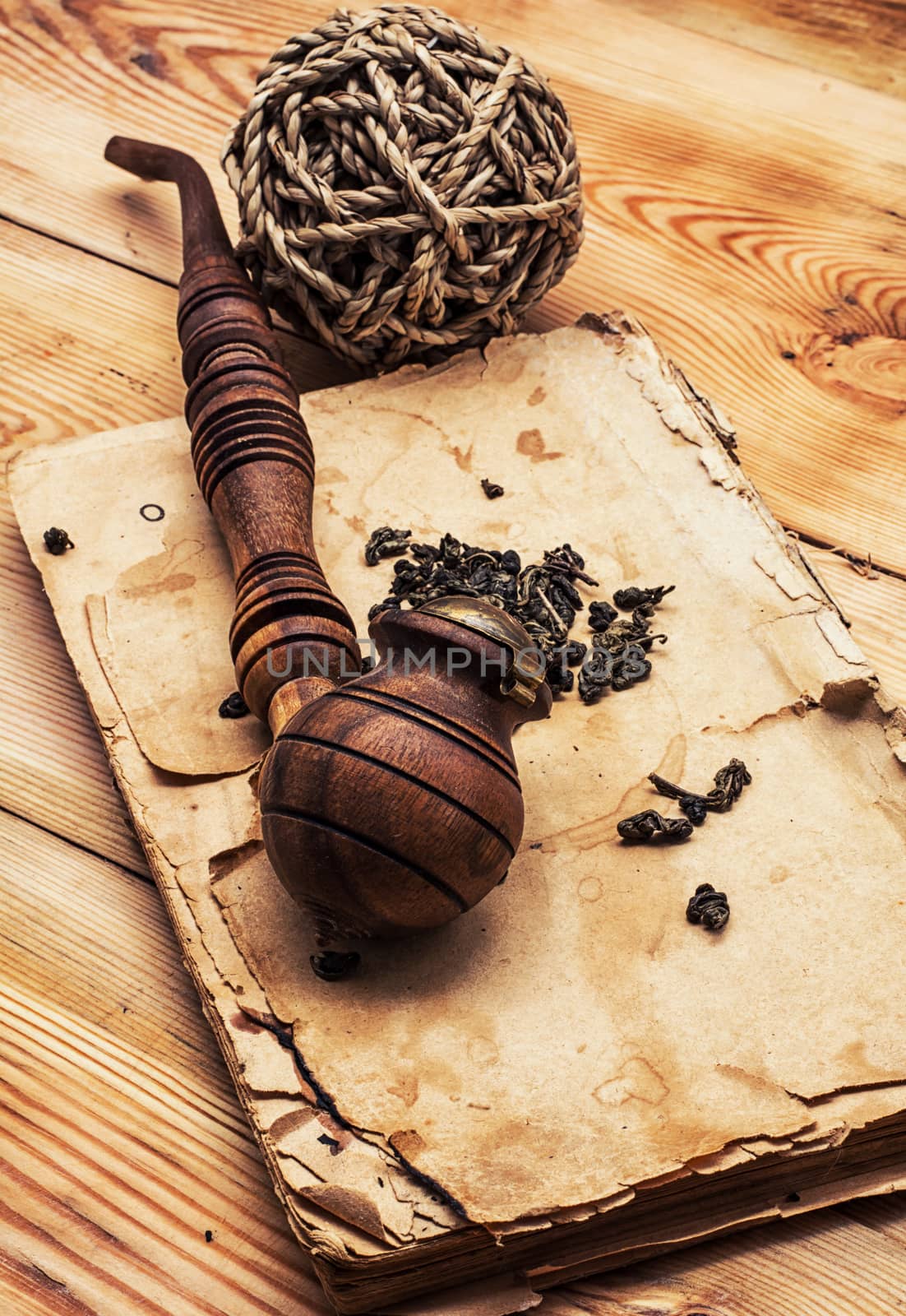Smoking pipe in a retro style,dark chocolate  on wooden background