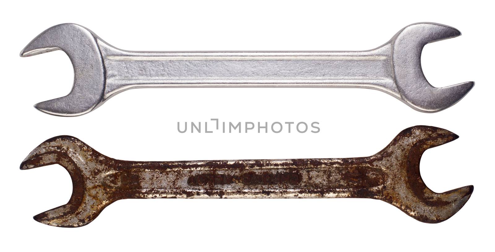 Two wrenches one rusted, one new next to each other