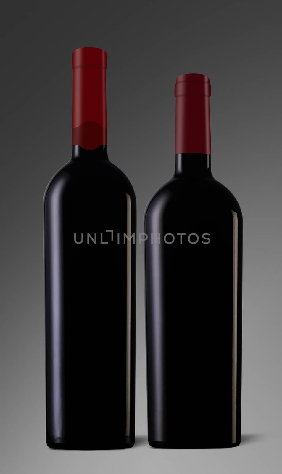Two red wine bottles with caps and no label on grey background