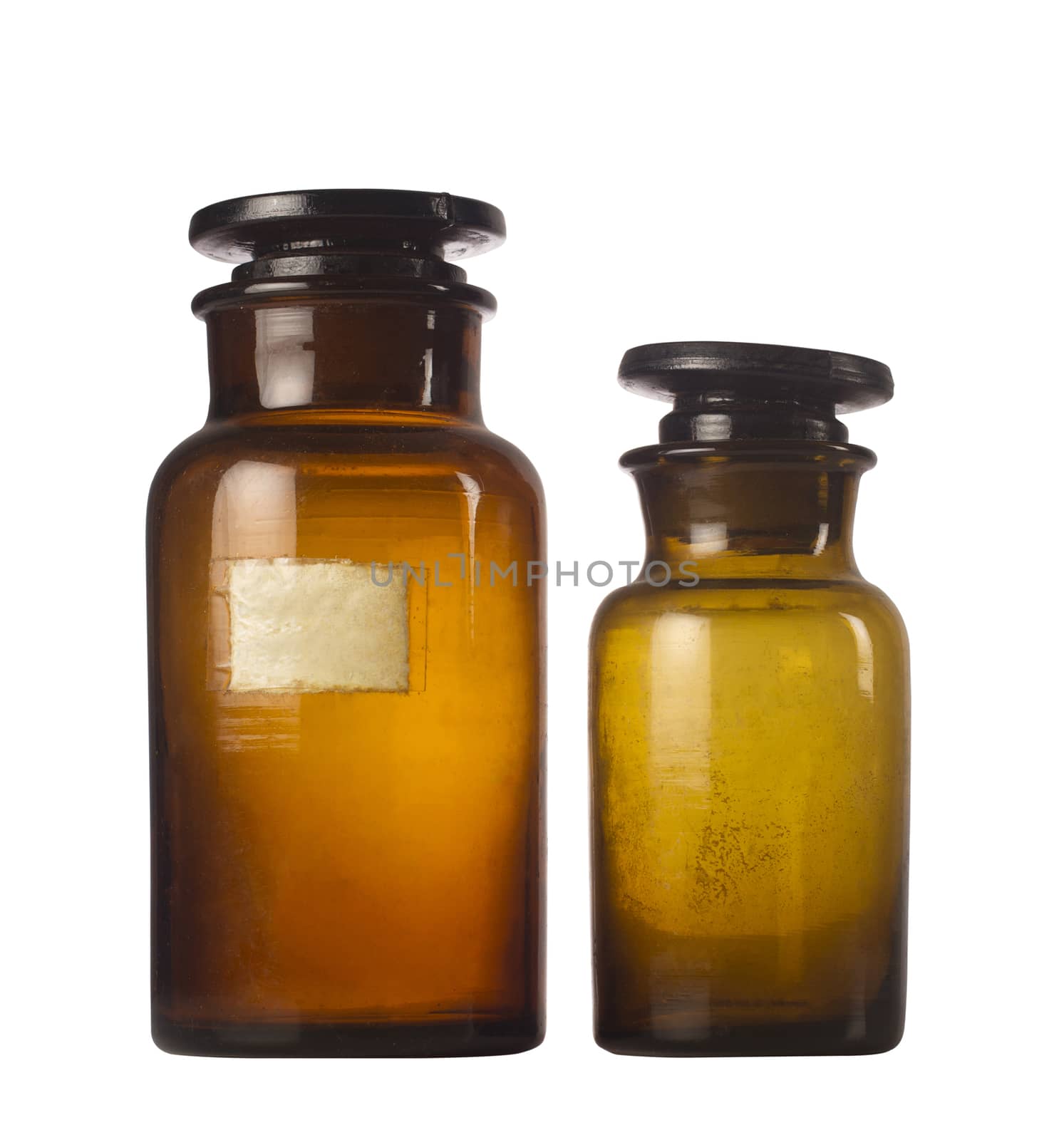 Two old medical brown glass jars isolated on white background