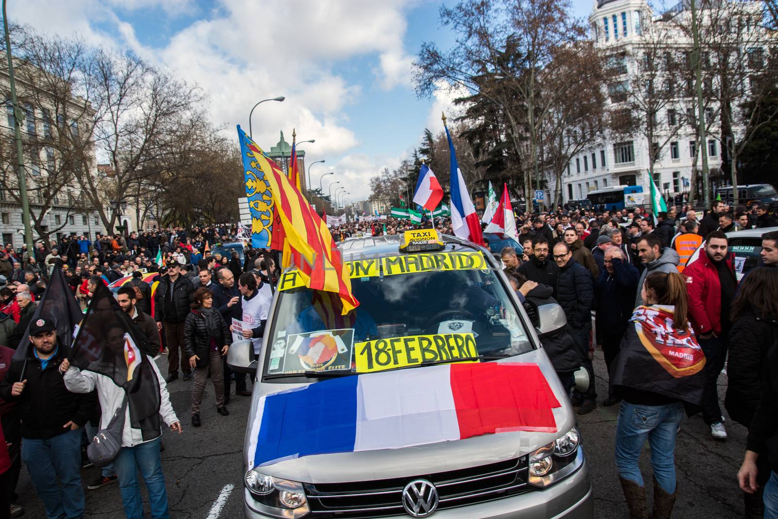 SPAIN, Madrid: French flags are seen on a cab as thousands of taxi drivers demonstrate against deregulation and ride-hailing companies such as Uber, in Madrid, on February 18, 2016.