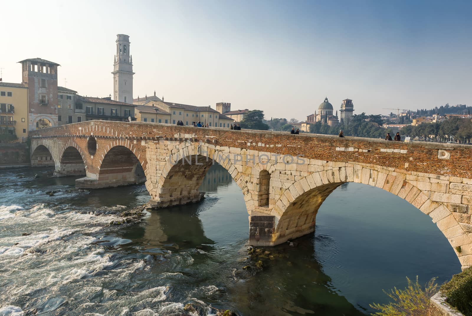 Ponte Pietra on river Adige, ancient roman bridge in the old town of Verona, Italy