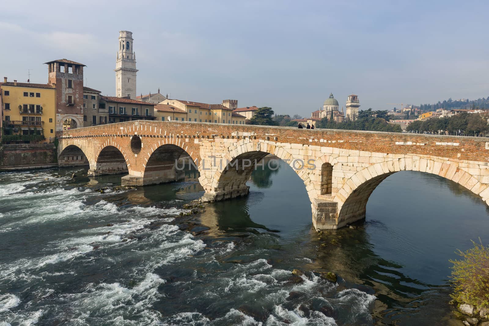 Ponte Pietra on river Adige, ancient roman bridge in the old town of Verona, Italy