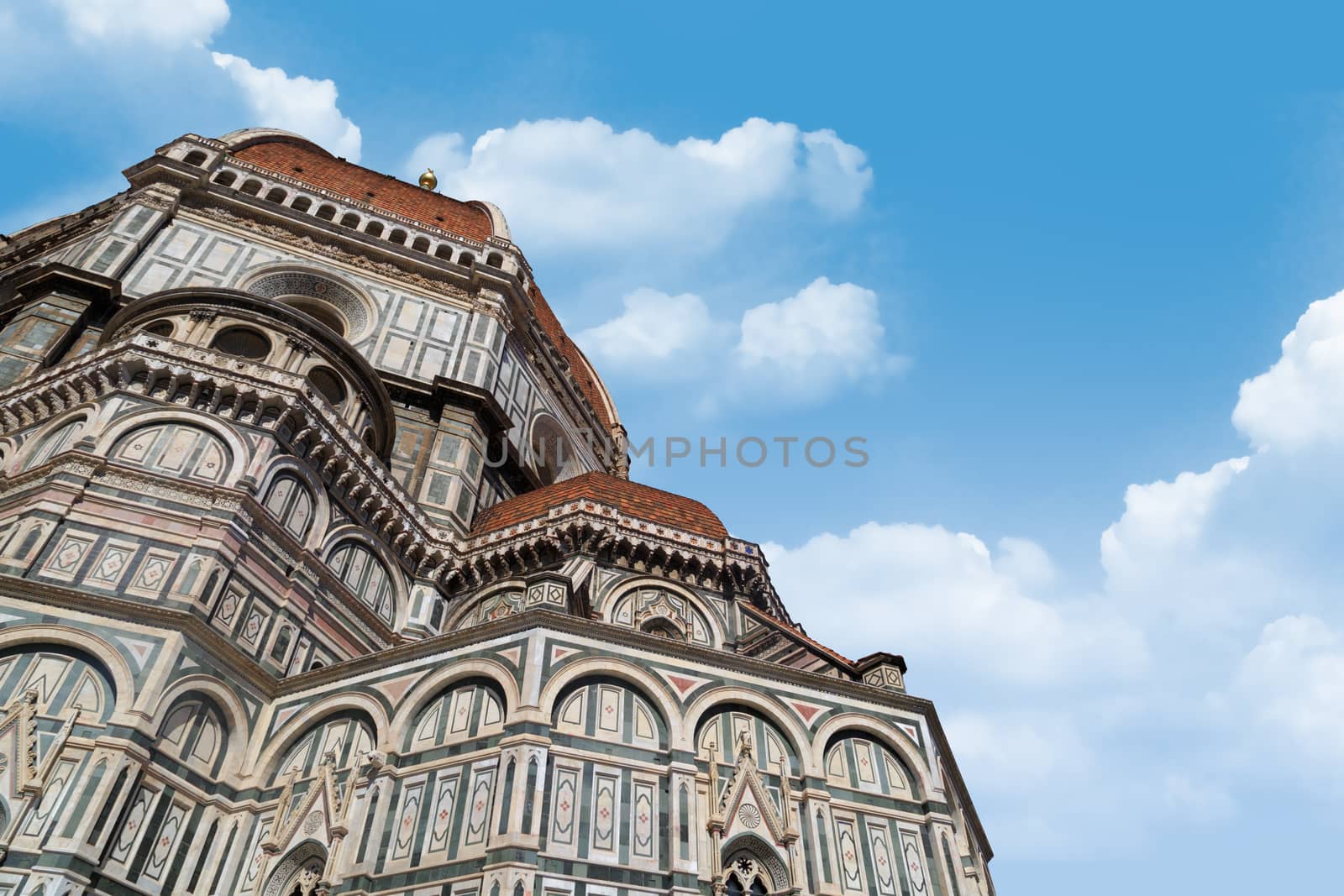 Close up detailed view of famous historical Florence Duomo, Santa Maria Del Fiore, on cloudy sky background.