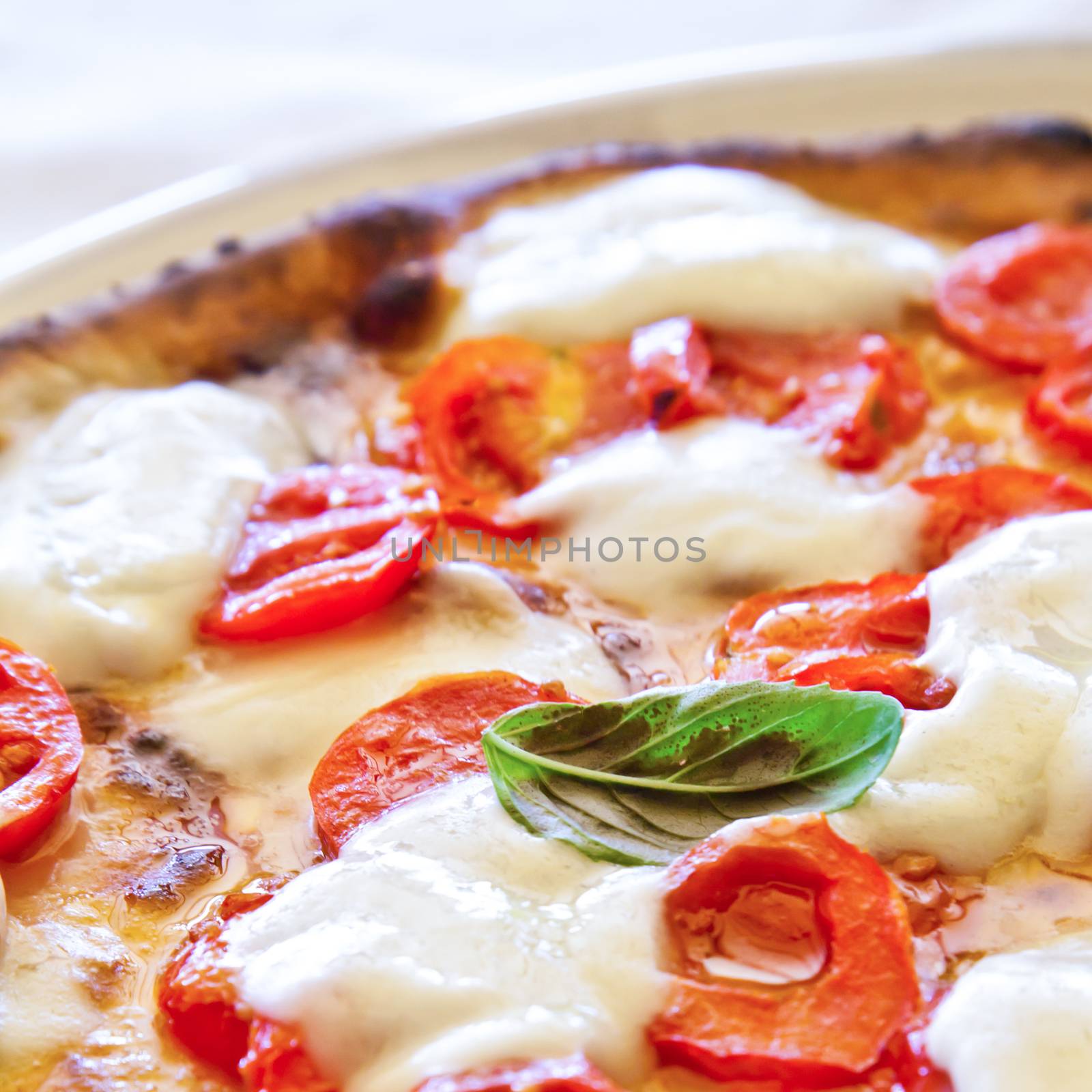 This is a true Italian Pizza. Traditional Pizza Margherita served in a Capri's restaurant, Naples Gulf, Italy.