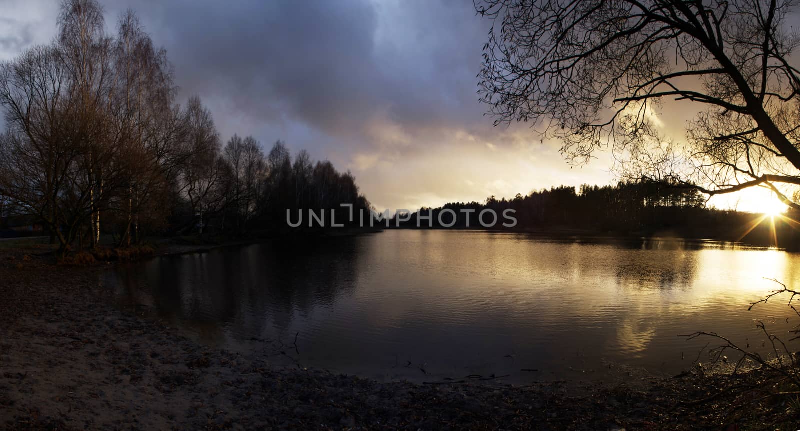 misty autumn sunset in lake by dolnikow
