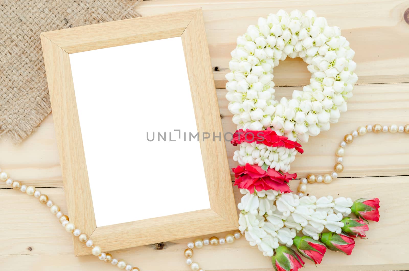 Blank wooden photo frame with flower, Save clipping path.