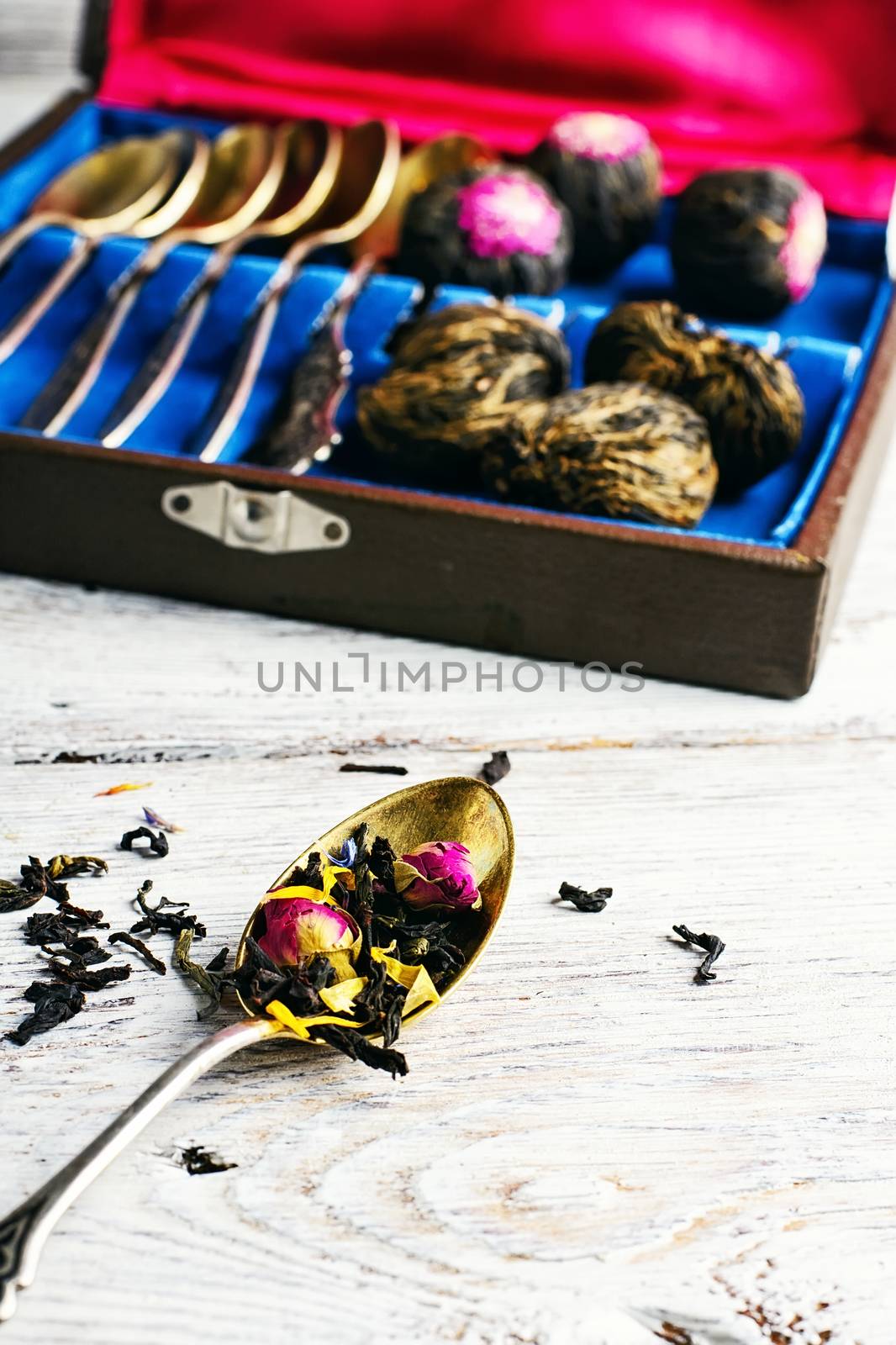 Aromatic teas and a set of spoons on a light background