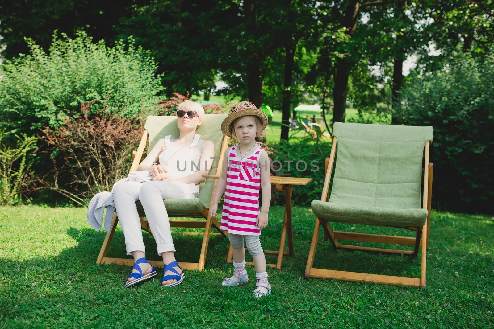 Mother and daughter in the park by sarymsakov