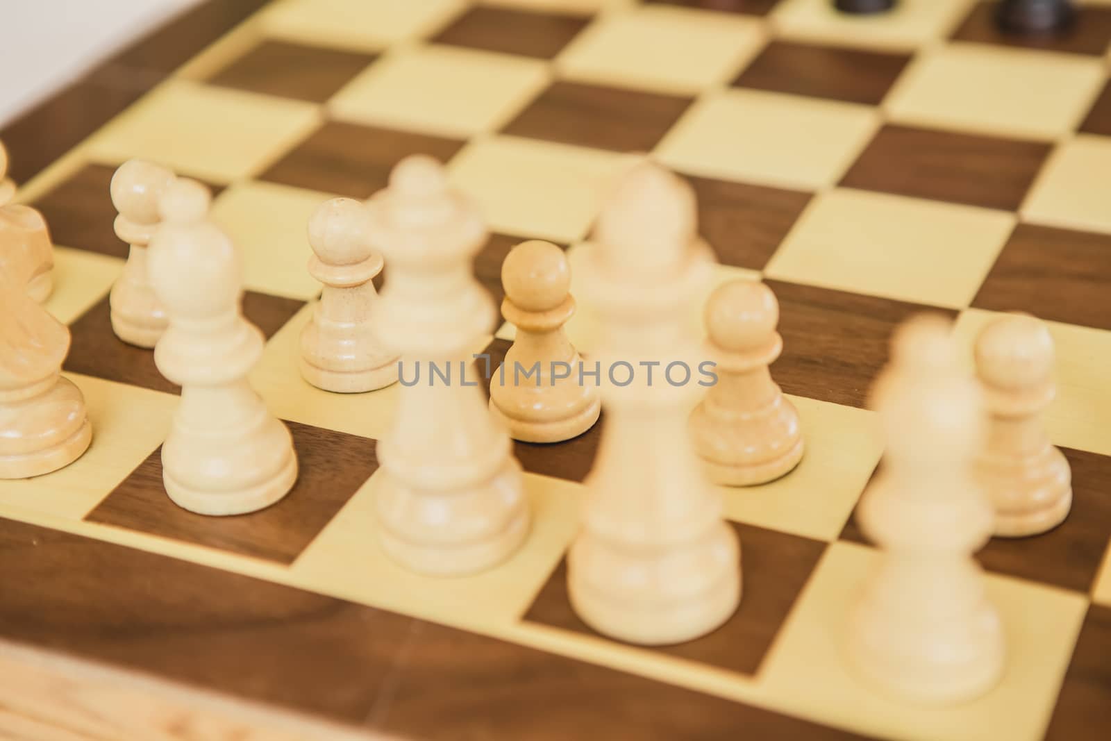 Chess. White board with chess figures on it. Plan of battle.